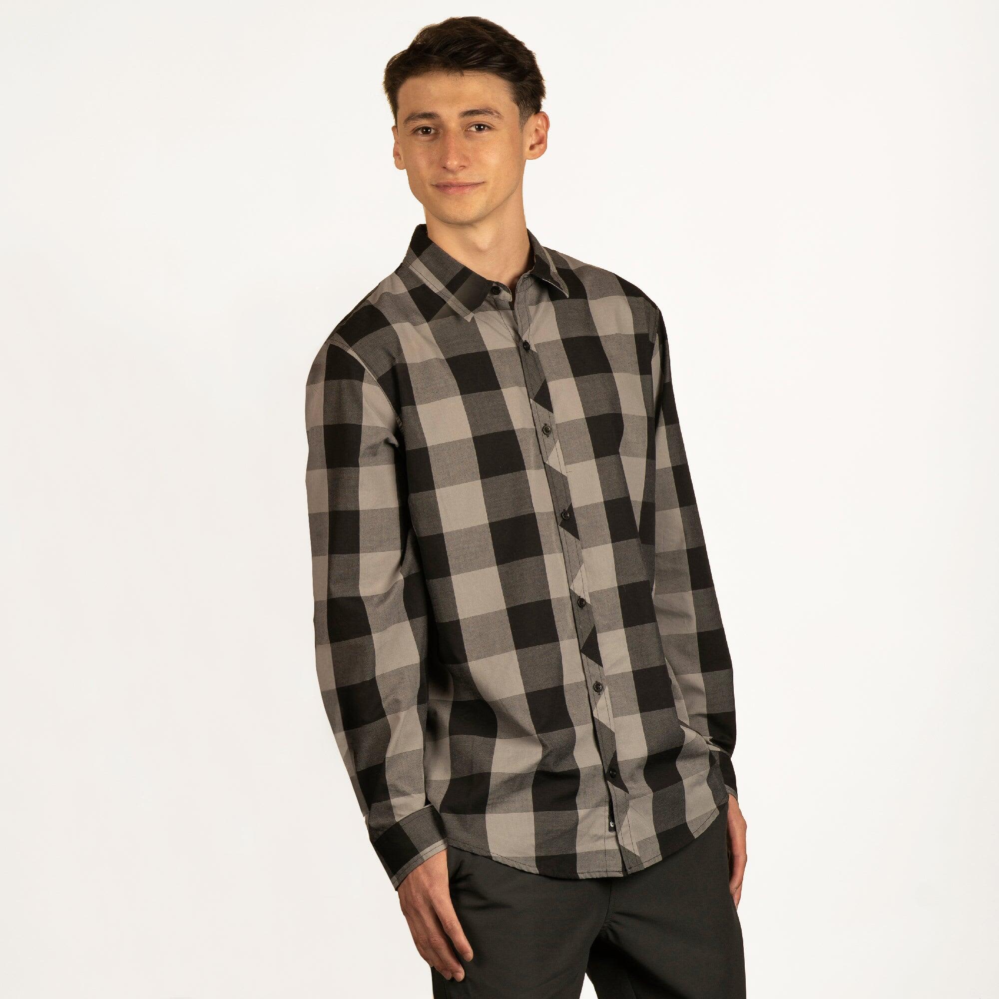 A long-sleeve, button-up shirt featuring a black and grey plaid pattern, with a logo on the chest. Buffalo Yarn-Dyed Long Sleeve Shirt - Image 1