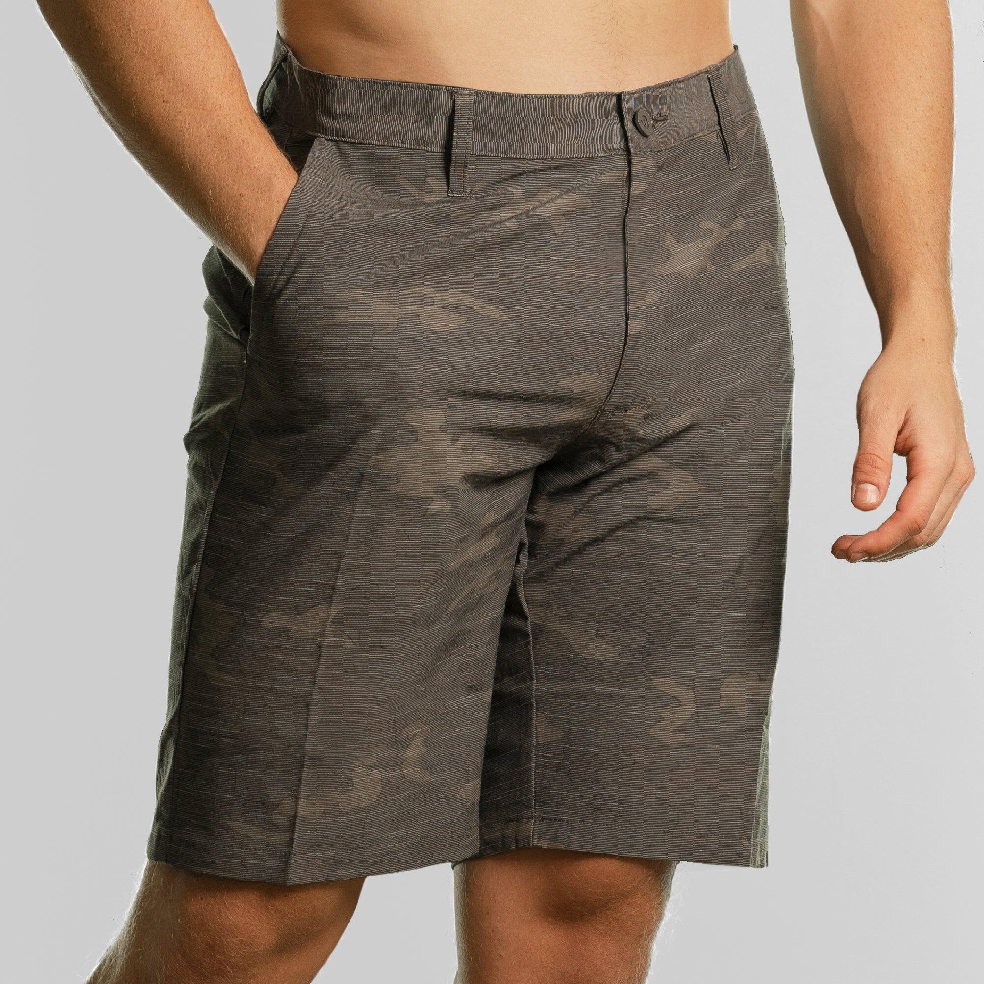 Coated dual function shorts in grey camouflage, featuring pockets and a casual fit. Includes branding. Coated Dual Function Shorts - Image 1