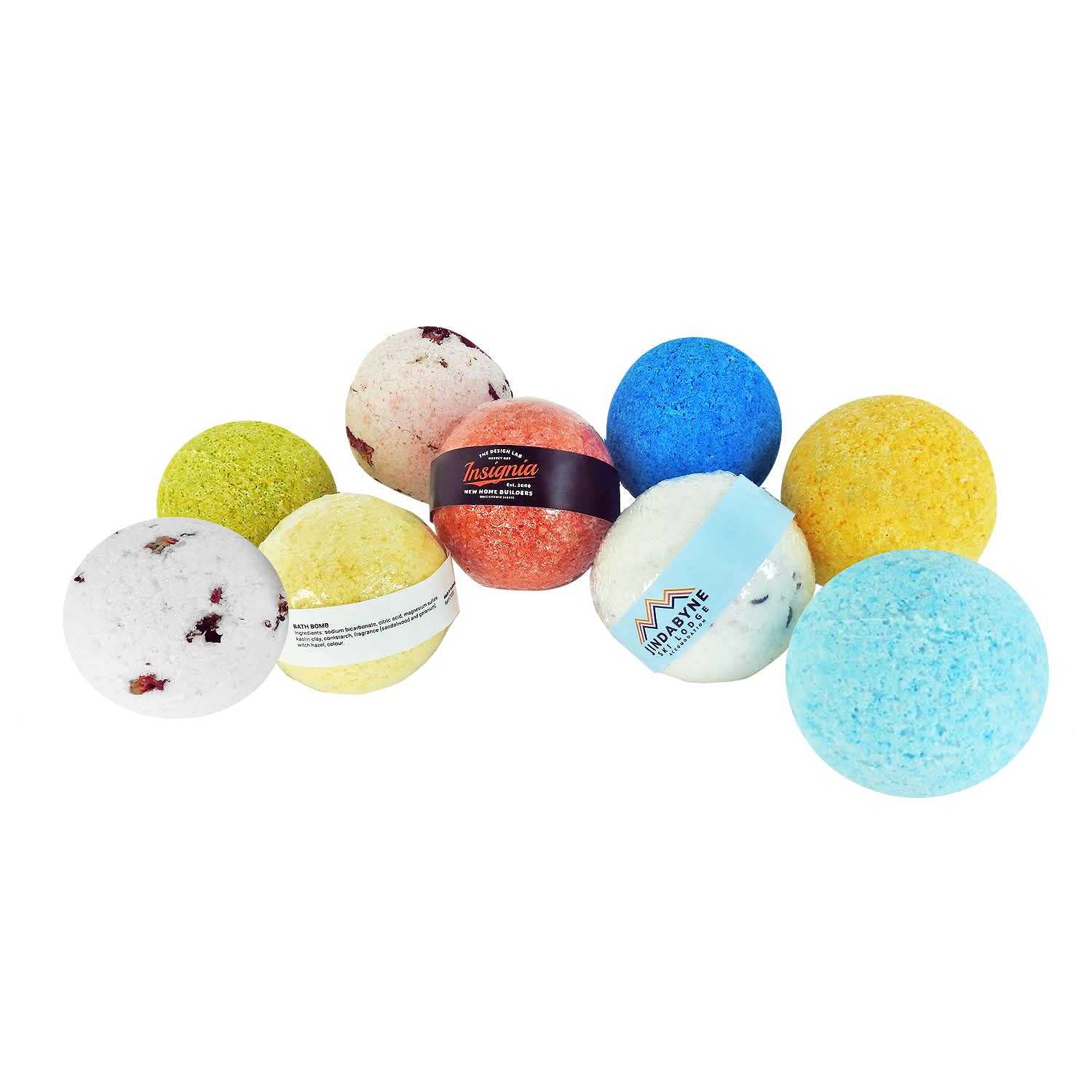A collection of bath bombs in various colours, including blue, green, yellow, orange, and white, with assorted textures. Bath Bomb - Image 1