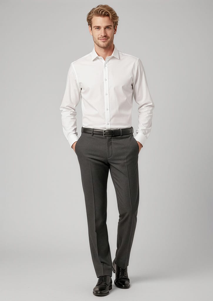 A man stands wearing a white shirt and grey classic flat pants, paired with a belt and black shoes. The outfit includes branding. Mens Classic Flat Pant - Image 1