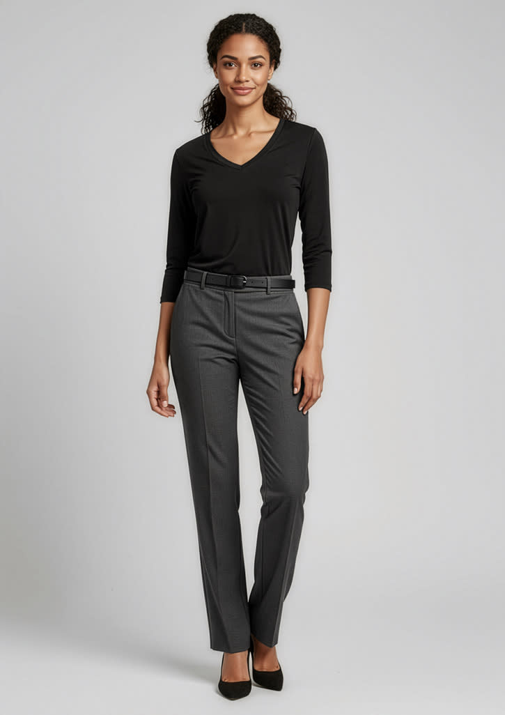 A woman wearing a black top and grey classic pants, standing in a relaxed pose against a neutral background. Womens Classic Pant - Image 1