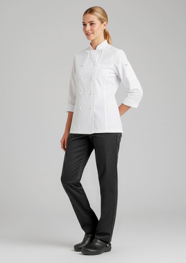 A model wears a white chef's jacket paired with black pants, showcasing a professional culinary uniform. Womens Dash Pant - Image 1