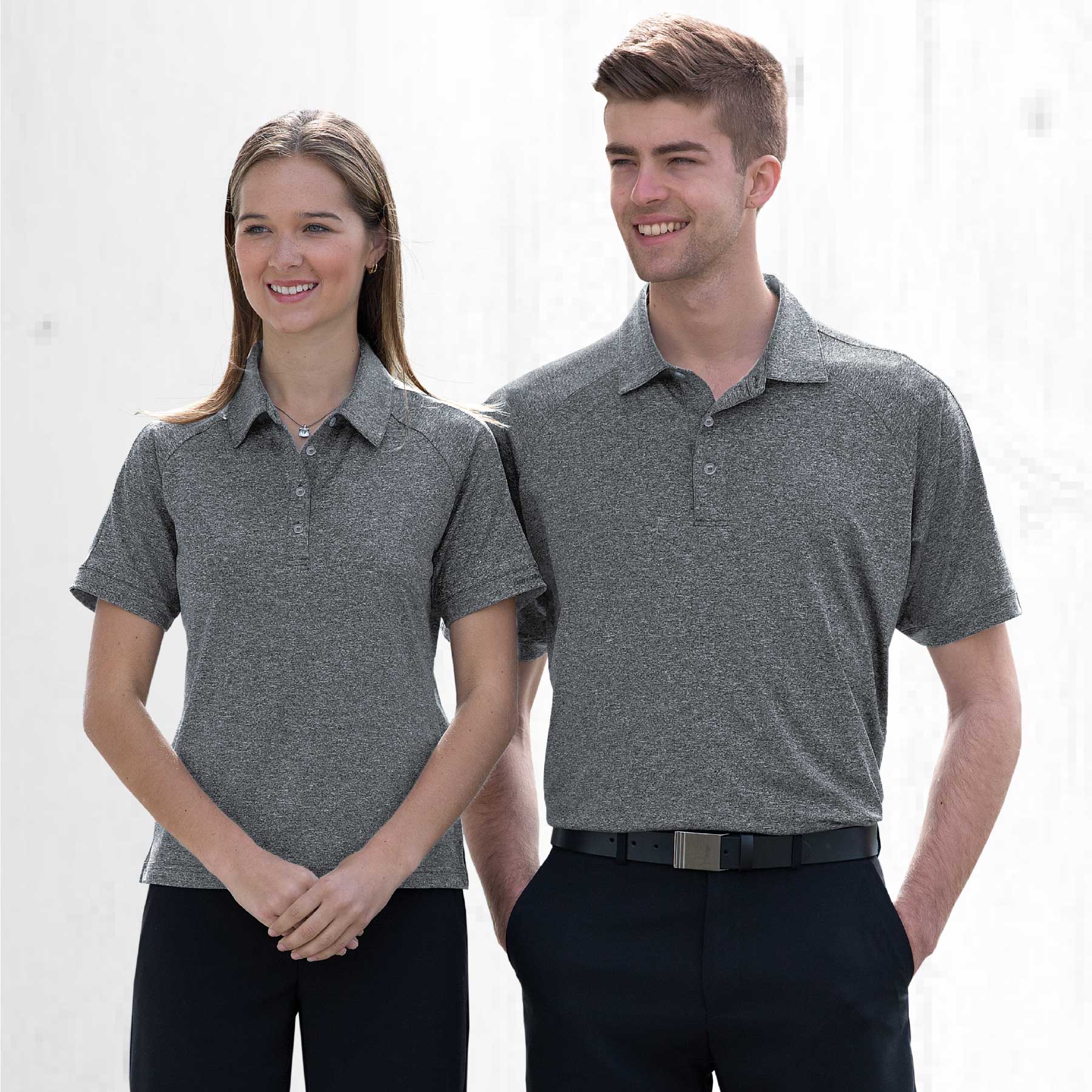 A grey melange polo shirt is worn by two models, one male and one female, against a light backdrop. Dri Gear Melange Polo - Mens - Image 1