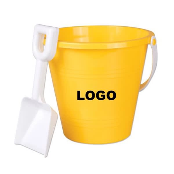 A yellow sand pail with a white shovel, featuring a logo on the bucket. Sand Pail and Shovel - Image 1