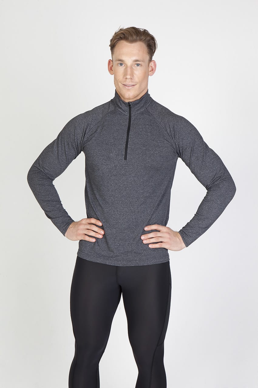 A man models a grey half zip mock neck jumper, featuring long sleeves and a fitted design. Mens Greatness Half Zip Mock Neck - Image 1