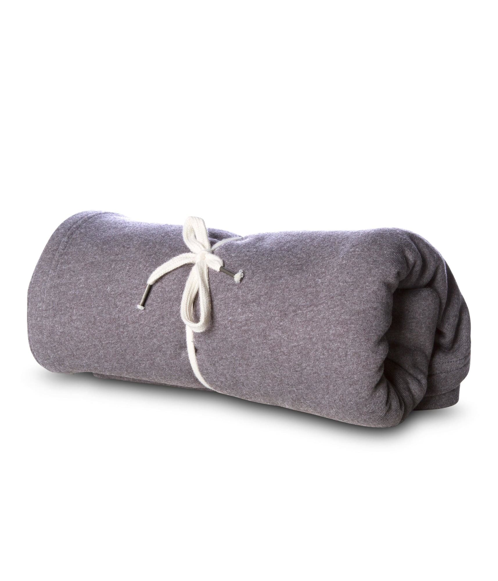 A rolled grey blanket tied with cream ties, featuring a simple, soft, and textured fabric. Special Blend Stadium Blanket - Image 1