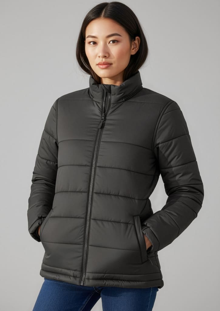 A women's puffer jacket in black with a high collar and side pockets, featuring a brand logo. Womens Alpine Jacket - Image 1