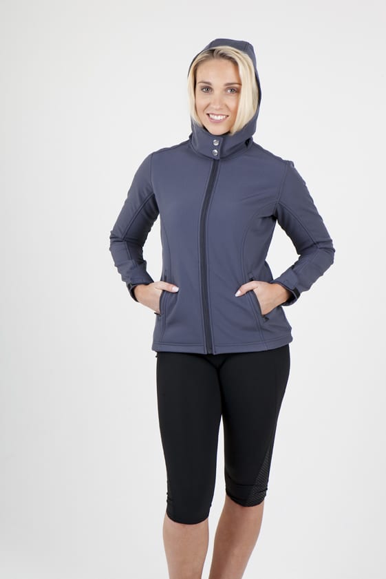 A women’s soft shell jacket in navy grey, featuring a hood and zippered front, with hand pockets. The model has a cheerful expression. Womens Soft Shell HOODED Jacket - TEMPEST Range - Image 1