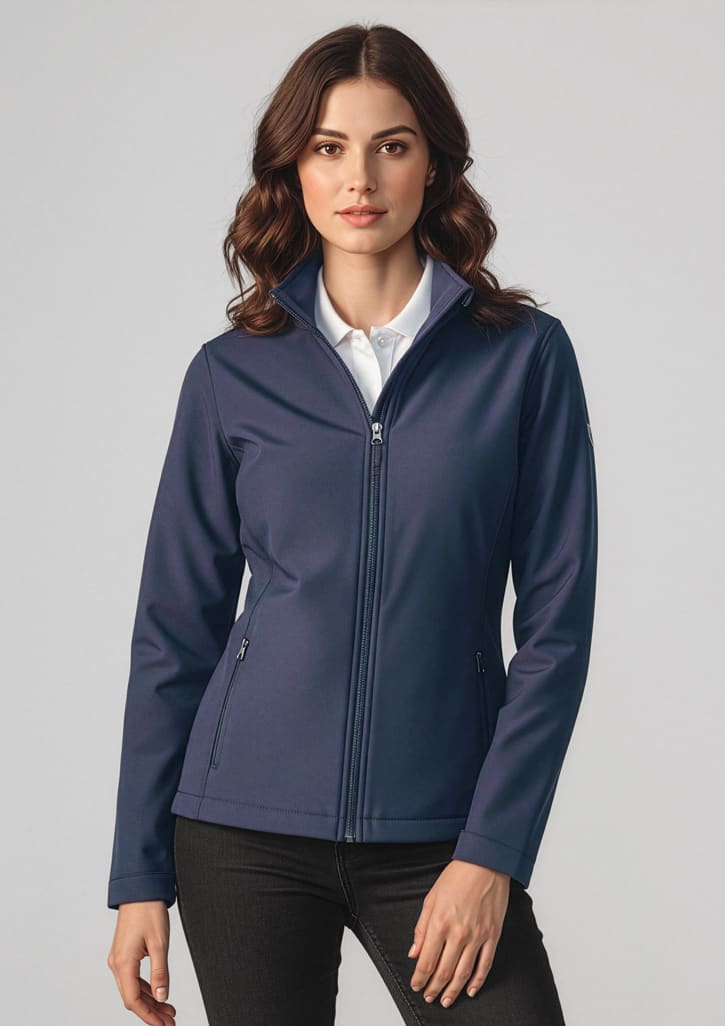 A navy soft shell jacket featuring a full zip and a collar, modelled by a woman with wavy hair. Womens Apex Jacket - Image 1