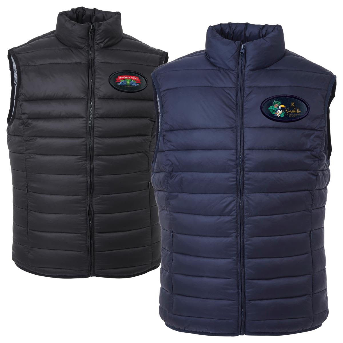 A black and navy puffer vest featuring a logo on the chest, with a zip-up front and quilted design. The Puffer Vest - Image 1