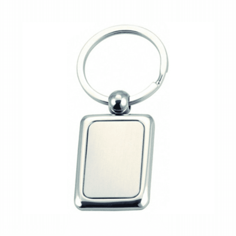 A metal keyring with a rectangular pendant, featuring a shiny silver finish. The pendant is blank and has a rounded attachment. Casey keyring - Image 1