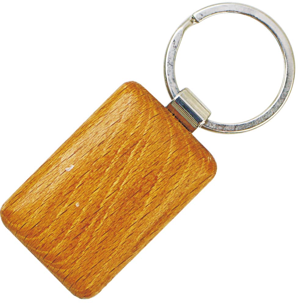 A wooden keyring with a smooth rectangular surface and a metal ring. The keyring has a warm, light brown colour. Forrest keyring - Image 1