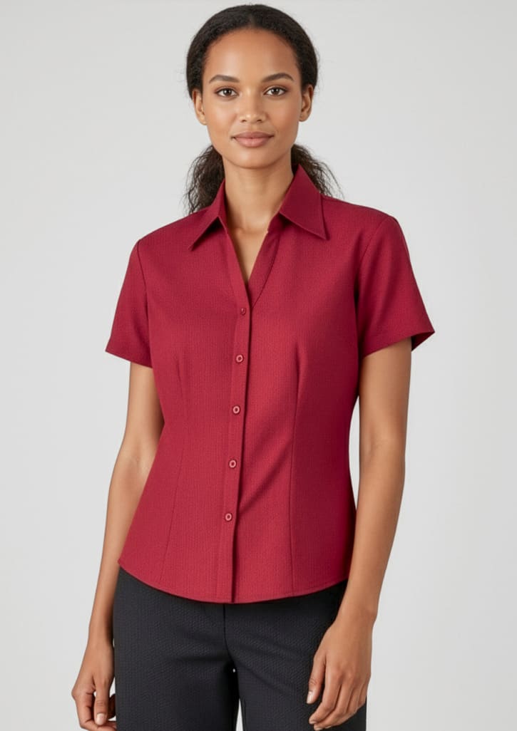 A red short sleeve button-up shirt with a fitted design and a collar. The shirt features buttons down the front. Womens Oasis Short Sleeve Shirt - Image 1