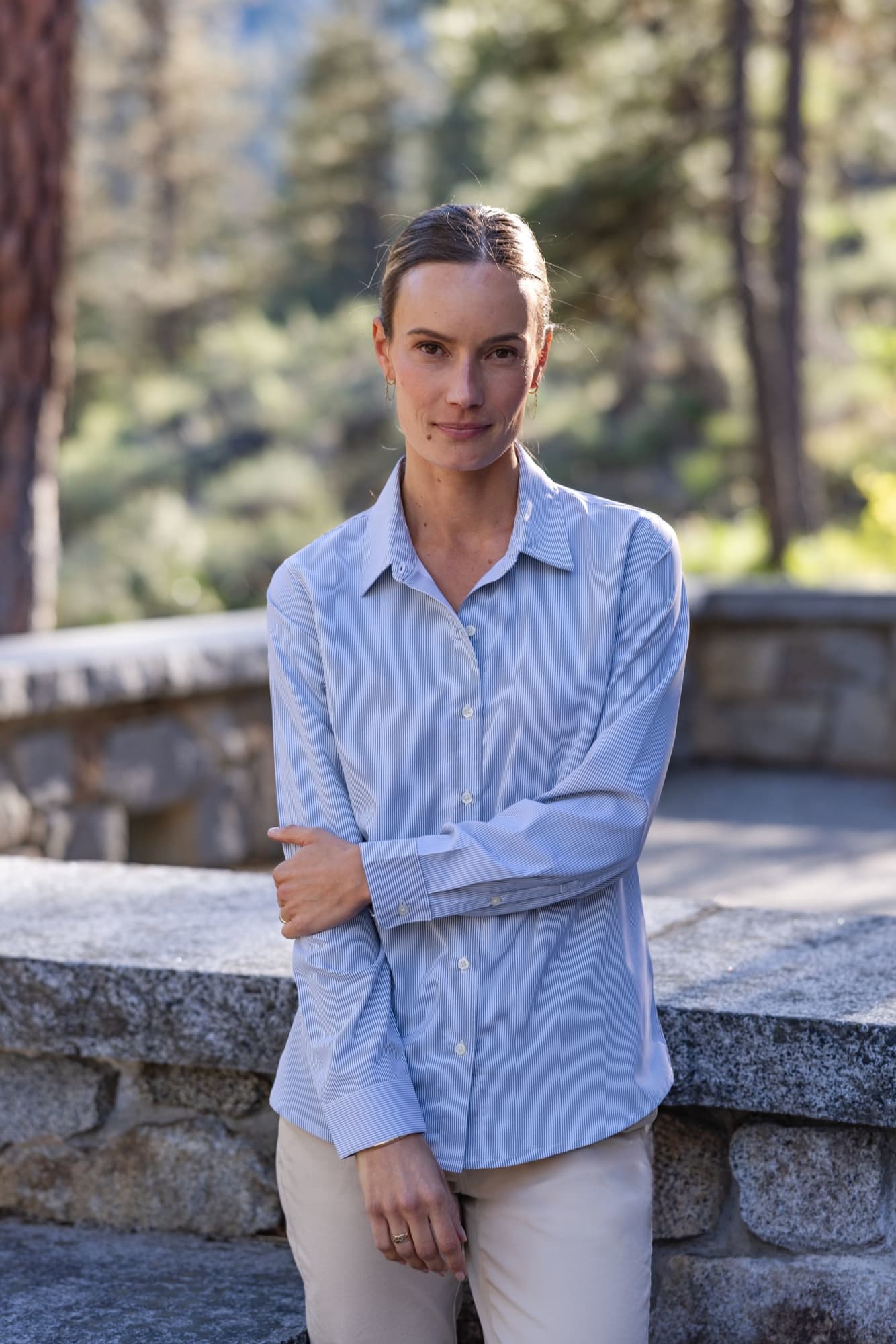 A light blue ladies' shirt with a pinstripe pattern, featuring long sleeves and a collar, displayed outdoors. Ladies Skyline Pinstripe Shirt - Image 1