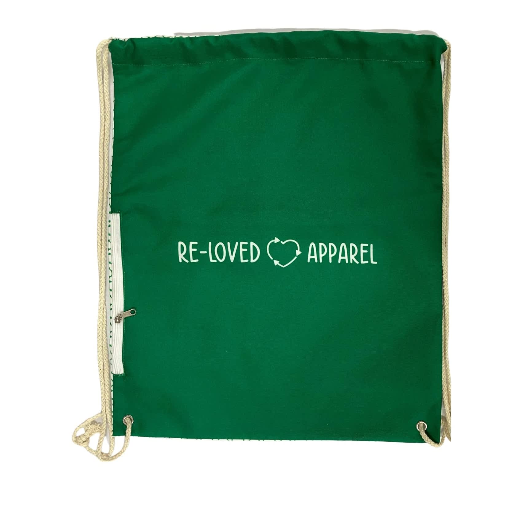 A medium green drawstring backpack made of organic cotton, featuring a pocket and a logo. Marlu Organic Cotton Drawstring Backpack with Pocket - Medium - Image 1