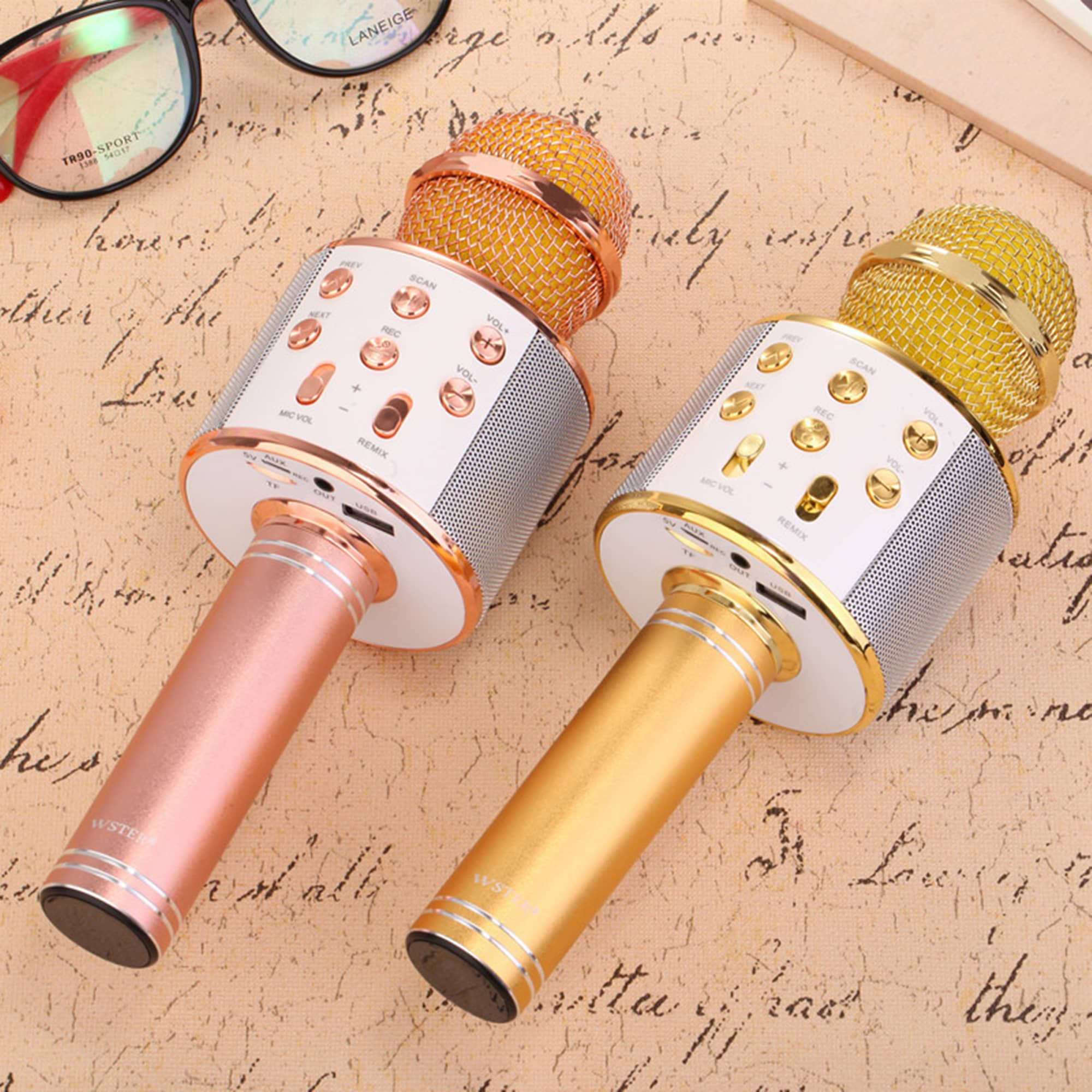 Two multifunctional microphones in gold and rose gold, featuring buttons and a mesh grille atop a sleek design. Multifunctional Microphone - Image 1