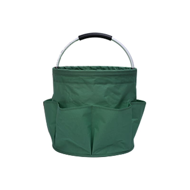 A green portable tool basket with a sturdy handle and multiple outer pockets for storage. Portable Tool Basket - Image 1