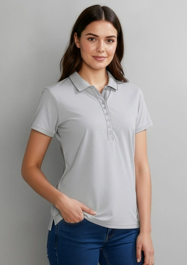 A grey women's short sleeve polo shirt with a classic collar and a button placket, featuring a logo on the chest. Womens Shadow Short Sleeve Polo - Image 1