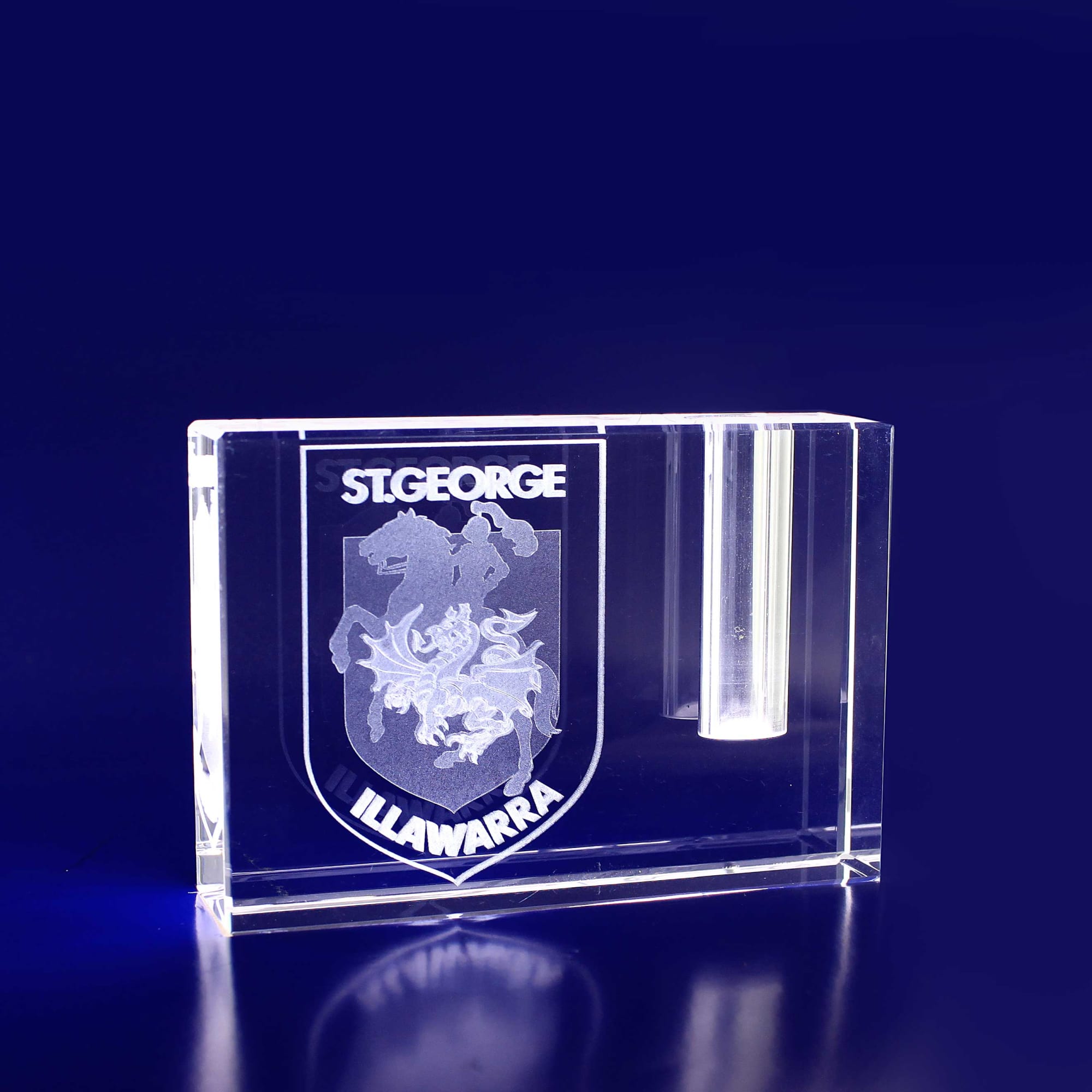 A clear crystal rectangle pen holder featuring an engraved logo, designed for business cards in a blue background. 3D Crystal Rectangle Crystal Pen Holder - Image 1
