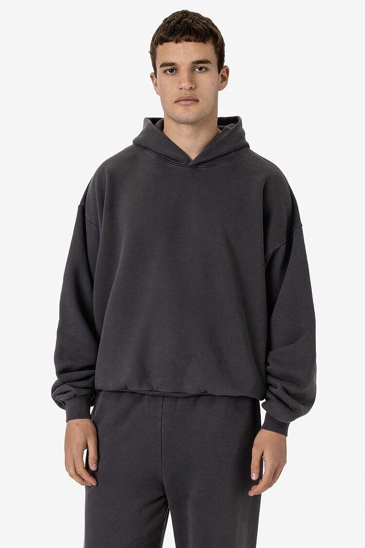 A dark grey garment dye plush fleece pullover hoodie with a hood, featuring a relaxed fit and long sleeves. Garment Dye Plush Fleece Pullover Hoodie - Image 1