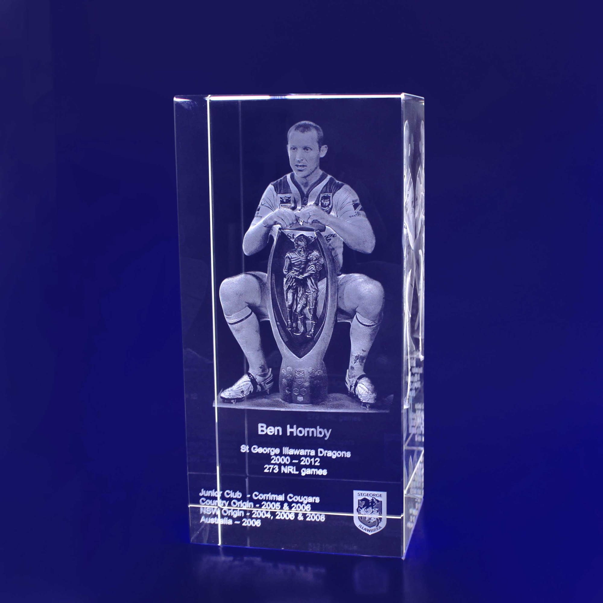 A clear 3D crystal rectangle featuring a detailed etched image of a rugby player, with a logo at the base. 3D Crystal Rectangle XL - Image 1