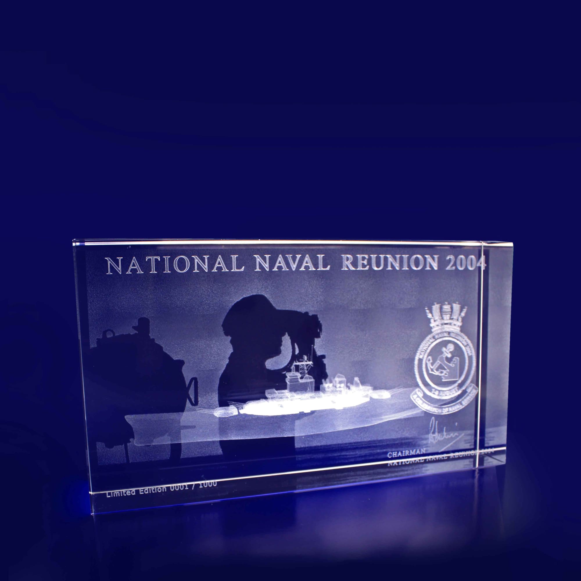 A clear crystal rectangle featuring an etched design, with details and a logo, on a blue background. 3D Crystal Rectangle Thin Large (200mm) - Image 1