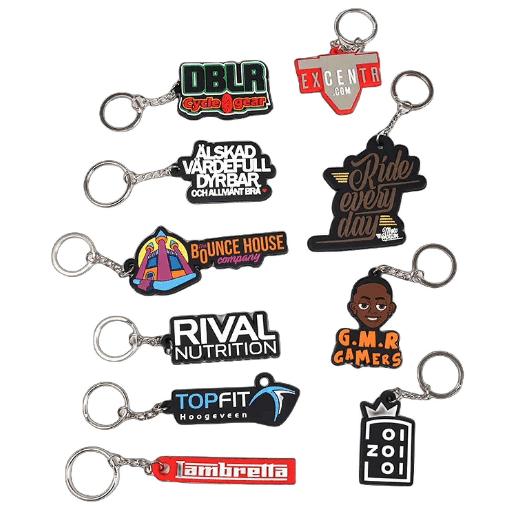A collection of custom moulded PVC keyrings in various colours, featuring multiple designs and logos. Moulded PVC Custom Keyring - Image 1