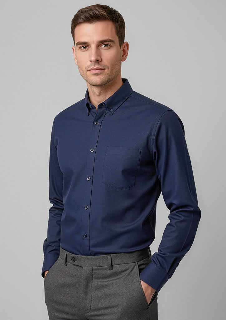 A navy long sleeve button-up shirt on a model, featuring a classic collar and a branded logo. Mens Dalton Long Sleeve Shirt - Image 1