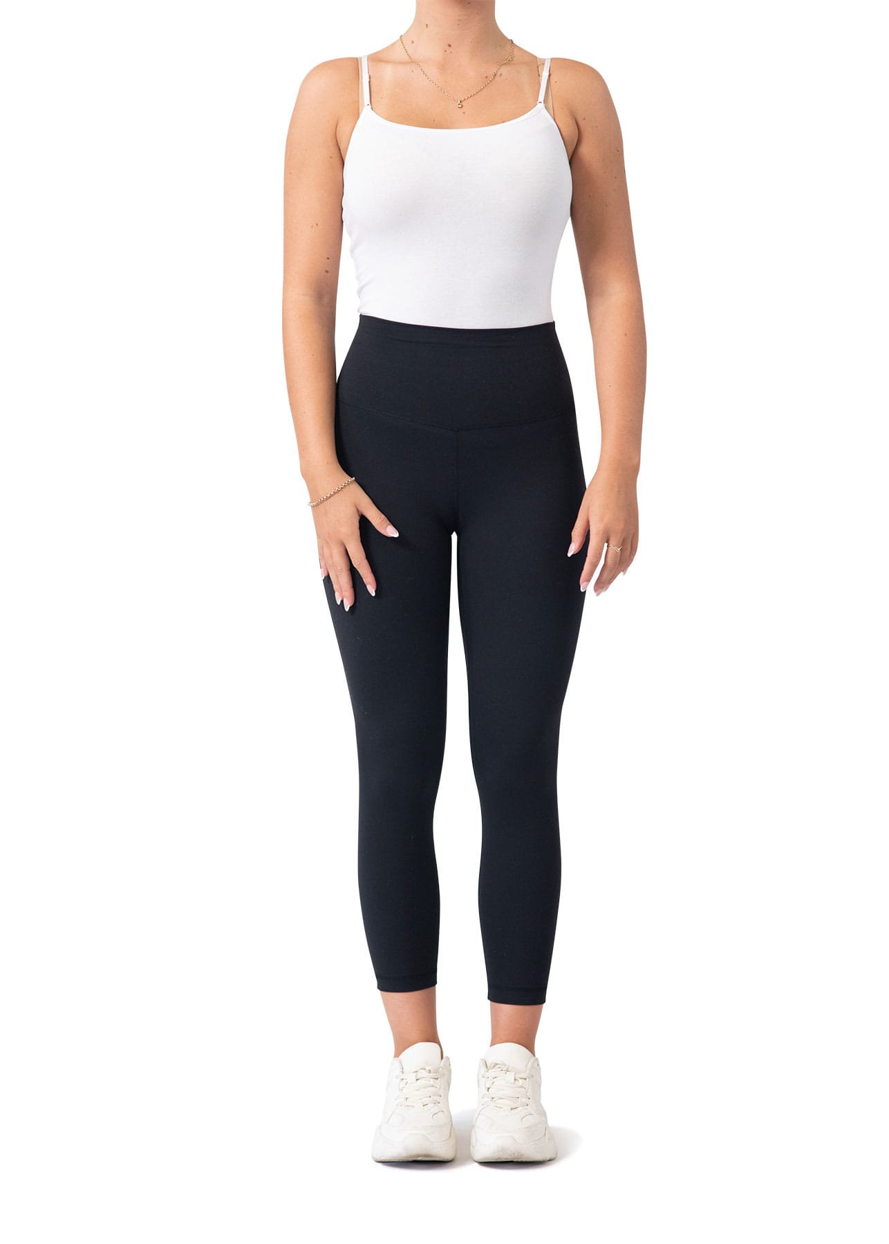 High rise full-length leggings in black, paired with a white tank top and white sneakers. Features a logo on the waistband. Womens High Rise full length leggings - Image 1