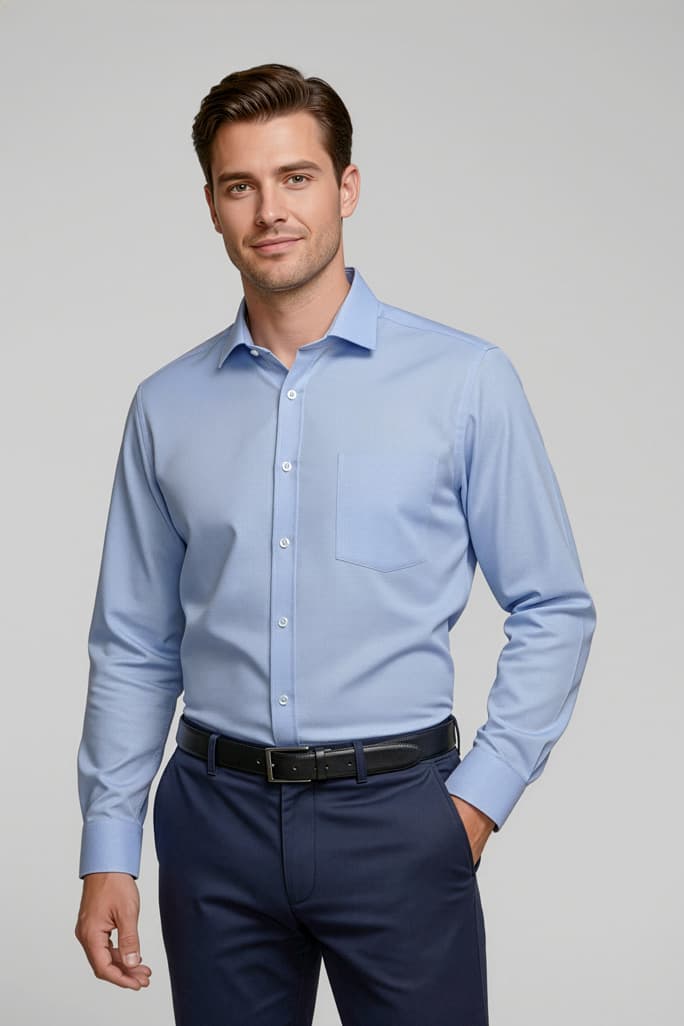 A light blue long sleeve button-up shirt for men, featuring a pocket and paired with dark trousers. Mens Regent Long Sleeve Shirt - Image 1