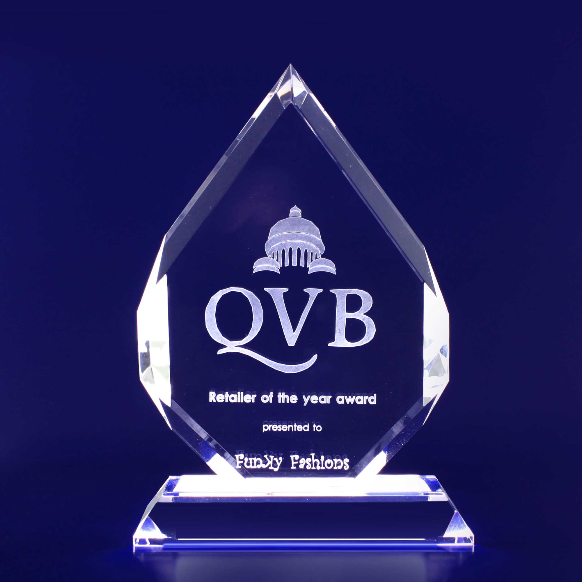 A clear crystal trophy shaped like a spear, with engraved text and a base for support. 3D Crystal Spear Trophy (240mm) - Image 1