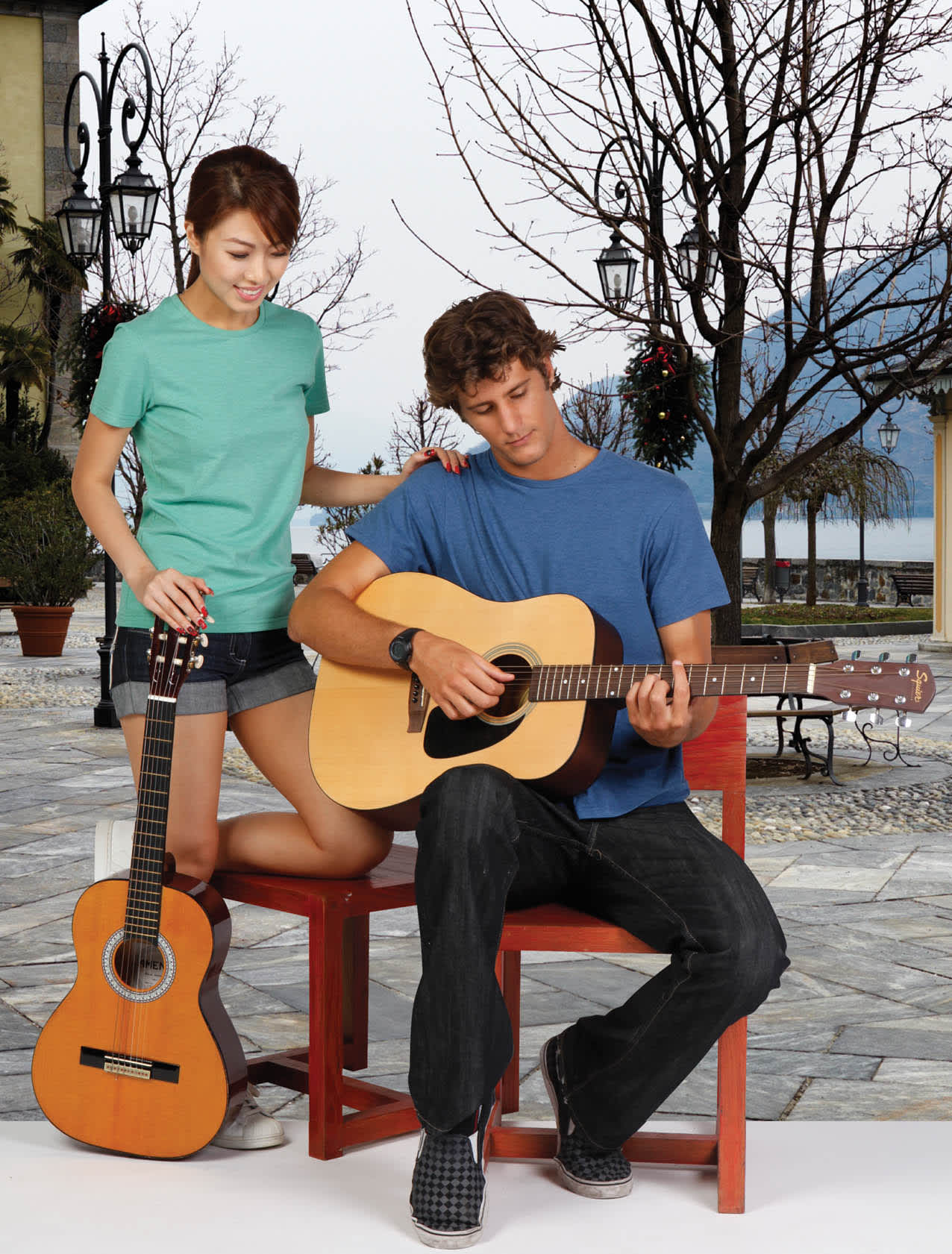 A blue and a green Men's Heavy Marl T-shirt worn by models, one playing guitar outdoors. Mens Heavy Marl T-shirt - Image 1