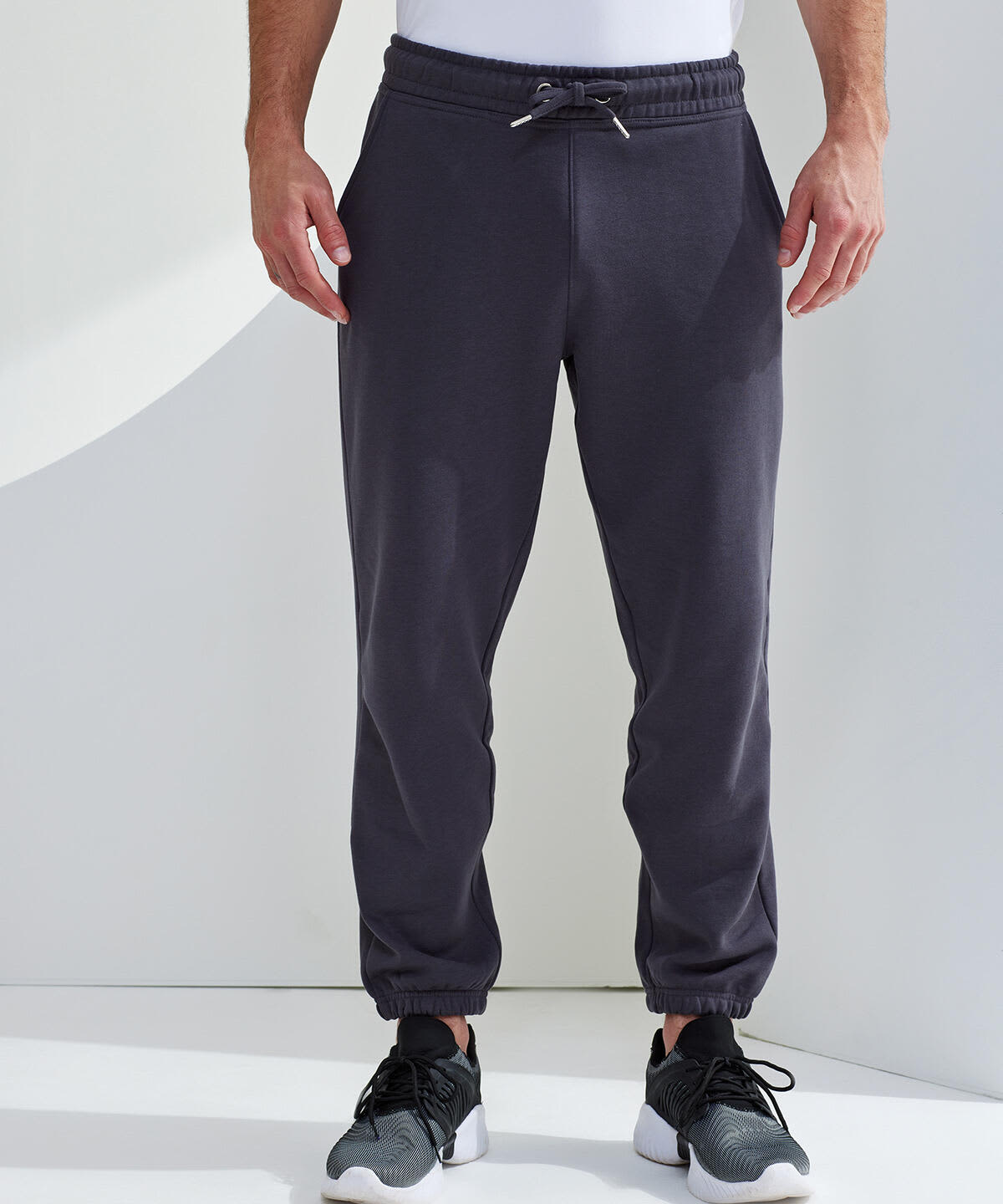 Classic joggers in dark grey with an elastic waistband and cuffs, featuring a drawstring detail. Classic Joggers - Image 1