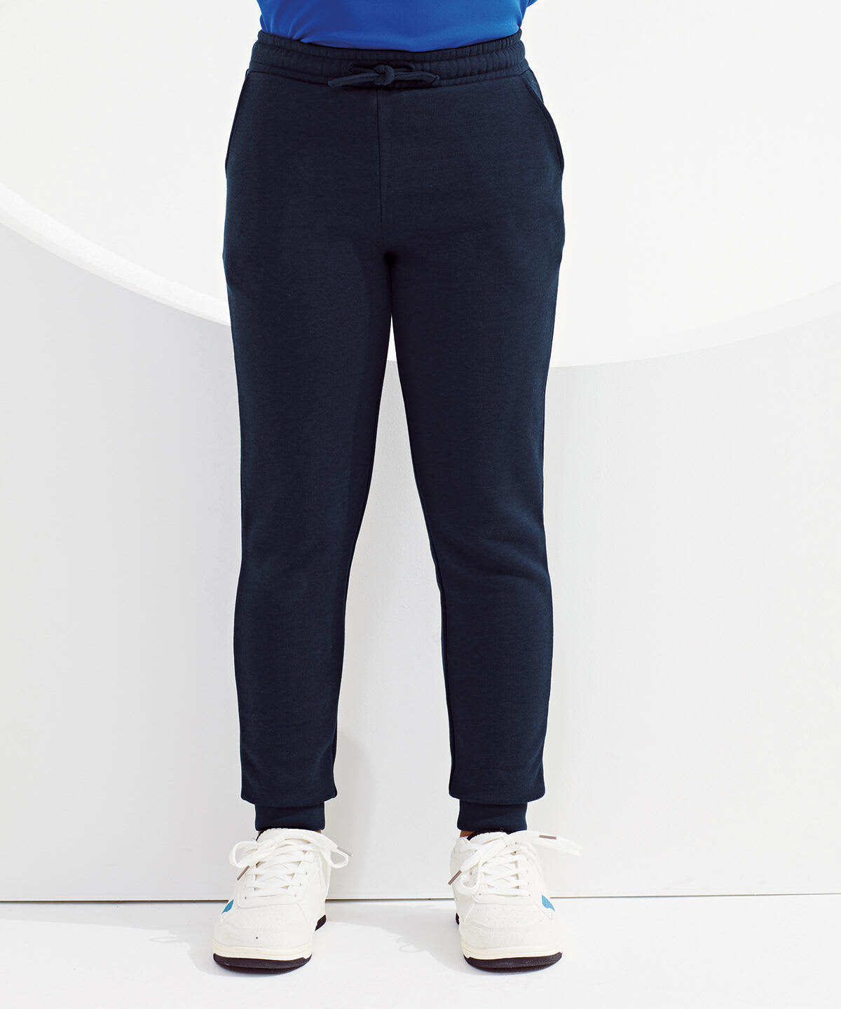 Navy blue kids' joggers with a drawstring waist and ribbed cuffs, displayed against a minimalist background. Kids Recycled Joggers - Image 1