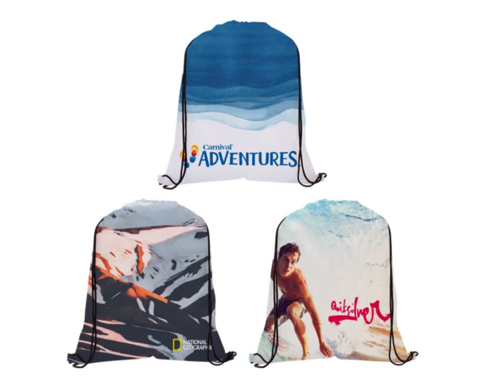 Three dye-sublimated drawstring backpacks in blue, white, and a mix of colours, each featuring unique designs and logos. Dye-Sublimated Drawstring Backpack - Image 1