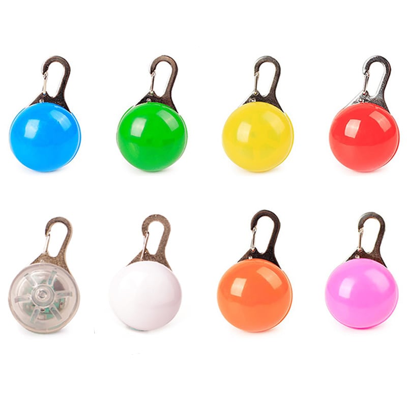 A range of clip-on LED pet safety lights in blue, green, yellow, red, white, pink, orange, and a light-up version. LED Clip-on Pet Safety Light - Image 1