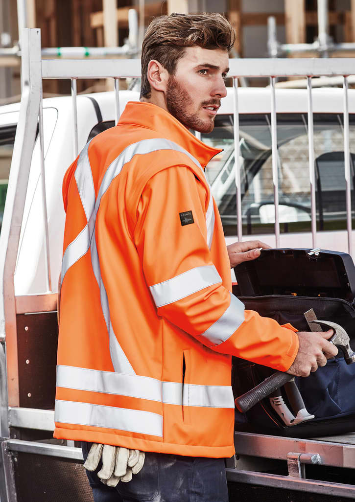 A bright orange unisex hi-vis softshell jacket with reflective stripes, displayed on a male model. Unisex Hi Vis X Back 2 In 1 Softshell Jacket - Image 1