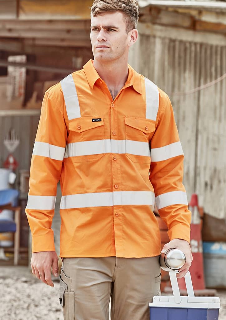 An orange long sleeve shirt with reflective stripes and a logo, worn by a man holding a drink bottle. Mens Bio Motion VIC Rail Long Sleeve Shirt - Image 1