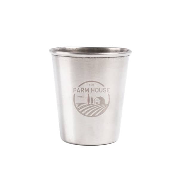 A stainless steel shot cup with a logo, featuring a shiny metallic finish. 60ml Stainless Steel Shot Cup - Image 1