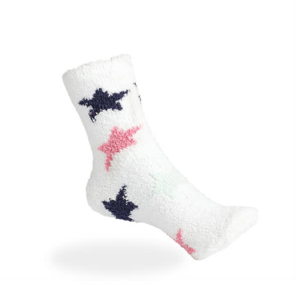 Warm fuzzy socks in white with pink and navy star patterns. The fabric appears soft and fluffy. Warm Fuzzy Socks - Image 1