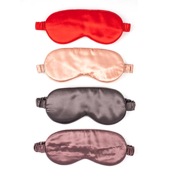 Four silk eye masks in red, peach, dark brown, and light brown, with elastic bands for comfort. Pure Silk Eye Mask - Image 1