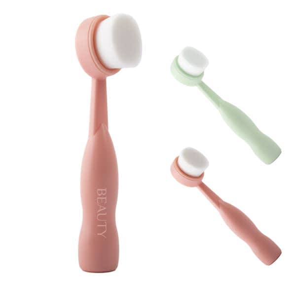 Three soft facial cleansing brushes in pink and green, featuring a smooth, round brush head and ergonomic handles. Each has a logo. Soft Facial Cleansing Brush - Image 1