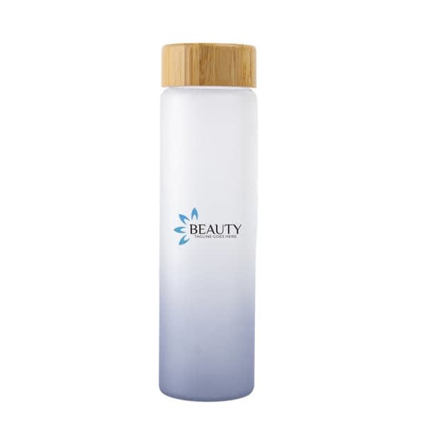 A drink bottle with a gradient design in frosted white to blue, featuring a bamboo lid and a logo. 20 oz. Gradient Color Frosted Glass Water Bottle - Image 1