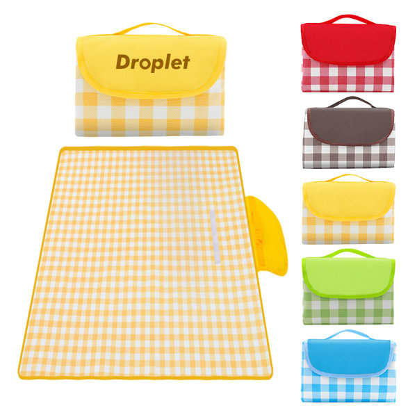 A yellow plaid picnic blanket folded with a carrying handle, featuring multiple colour options in the background. Oxford Cloth Plaid Picnic Blanket - Image 1