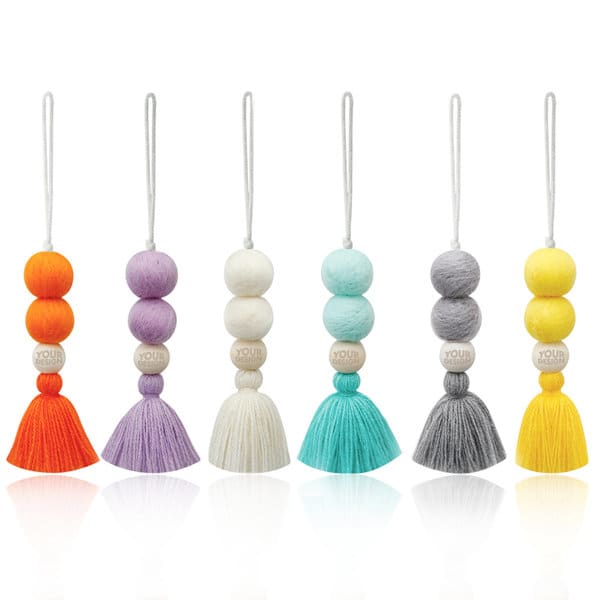 A collection of car essential oil tassel diffusers in various colours, featuring felt balls and tassels. Car Essential Oil Tassel Diffuser With Felt Ball - Image 1