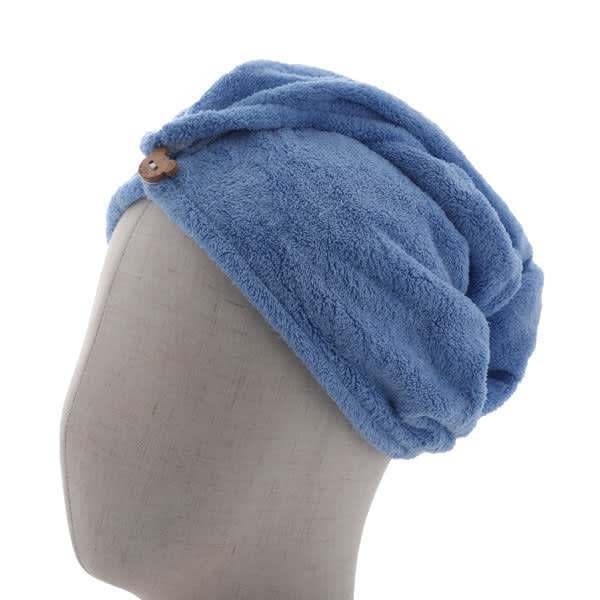 A blue coral fleece hair towel wrap displayed on a mannequin head, featuring a button detail. Coral Fleece Hair Towel Wrap - Image 1