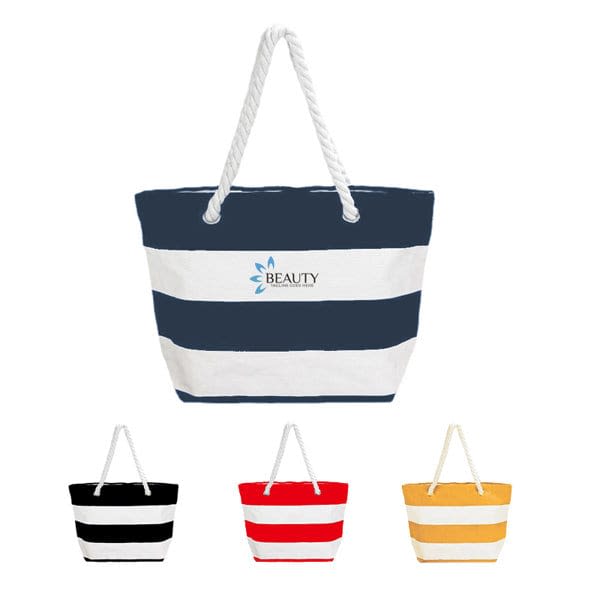 A striped canvas tote bag in navy and white with a rope handle, alongside options in black, red, and yellow. Striped Canvas Beach Tote Bag - Image 1