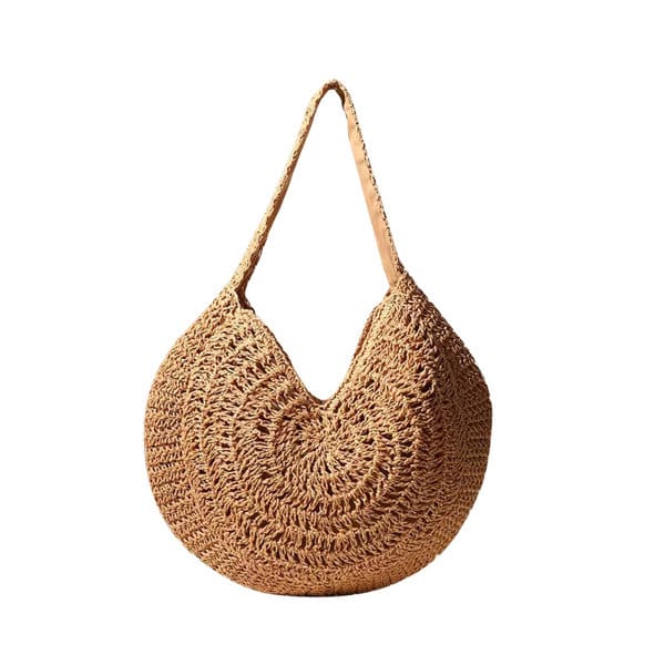 A woven straw tote bag in natural tones with a circular shape and a single shoulder strap. Straw Braided Circle Tote Bag - Image 1