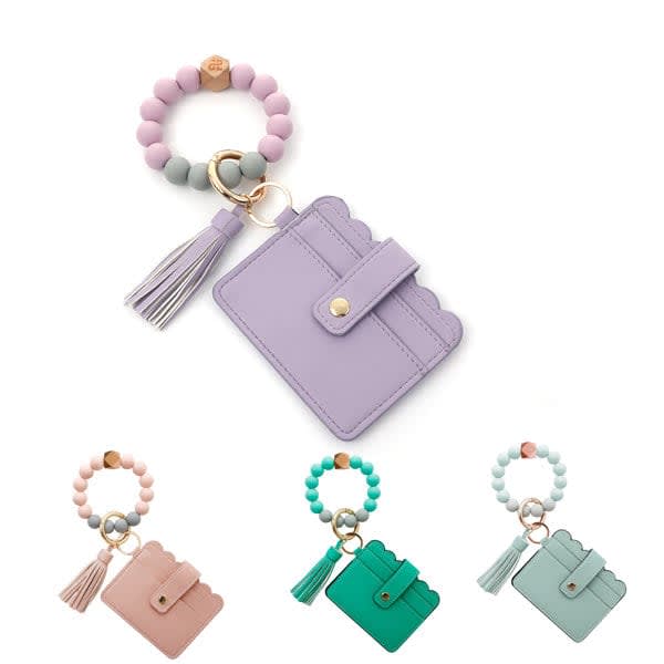 A collection of Women's Bracelet Wallet Keychains with tassels in lavender, mint green, pink, and teal. Women’s Bracelet Wallet Keychain With Tassel - Image 1