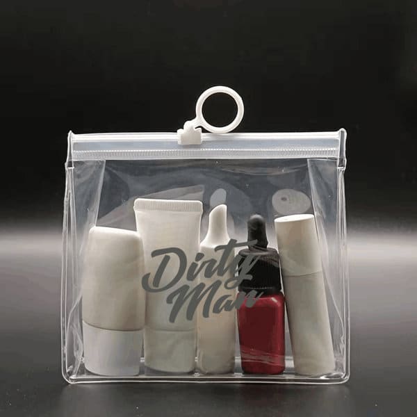 A transparent cosmetic zipper bag containing various skincare and makeup products in white and red containers. Custom Transparent Cosmetic Slide Zipper Bag - Image 1